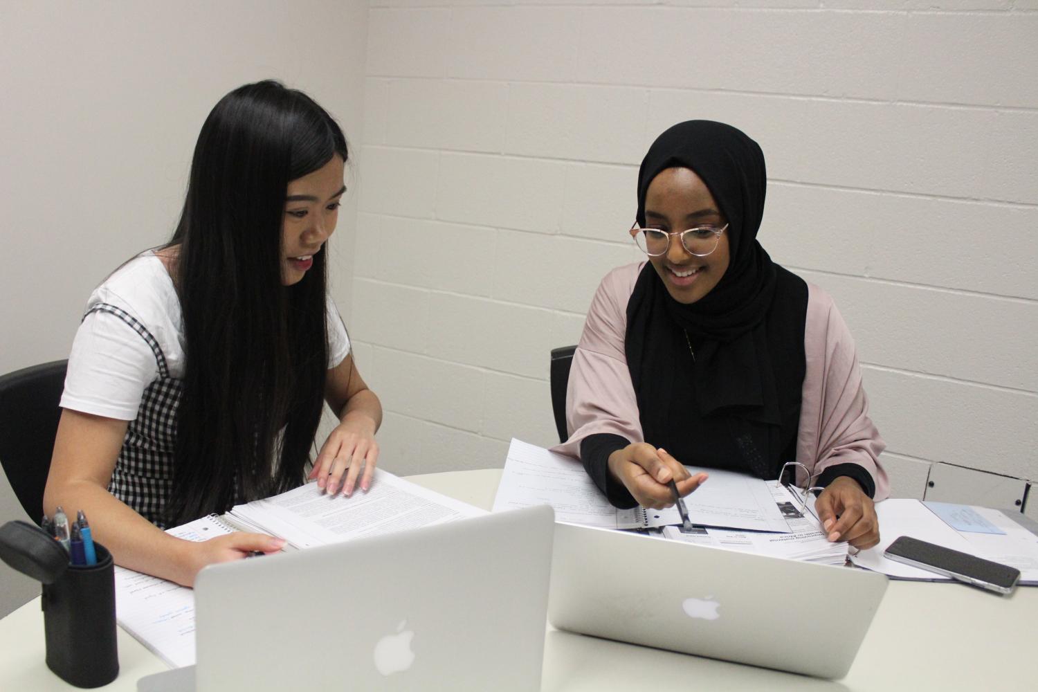 During+Falcon+Time+on+Sept.+6%2C+seniors+Tina+Pham+and+Milkise+Yassin+are+working+together+on+their+Research+and+Exhibition+classwork.+Pham+is+currently+in+the+Research+Methods+class+getting+ready+for+her+exhibition+next+semester%2C+and+Yassin+is+preparing+for+her+exhibition+that+will+be+presented+at+the+end+of+the+semester.+%E2%80%9CIt%E2%80%99s+a+lot+of+work%2C+but+I+know+it+will+be+beneficial+for+future+presentations+and+college+classes%2C%E2%80%9D+said+Pham.+%0A