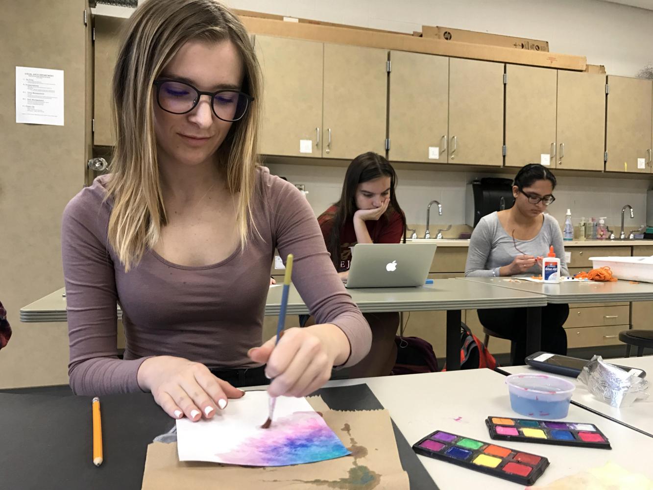 On Sept. 15 in AP Art, junior Karson Davis works on one of her breadth projects. The class consists of 24 college level projects. “I decided to take AP Studio Art because I wanted to be challenged and I wanted to see recognizable improvement in my art,” said Davis.
